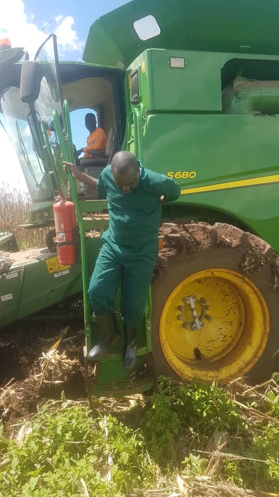 A member of the team beside one of the company’s combine harvesters